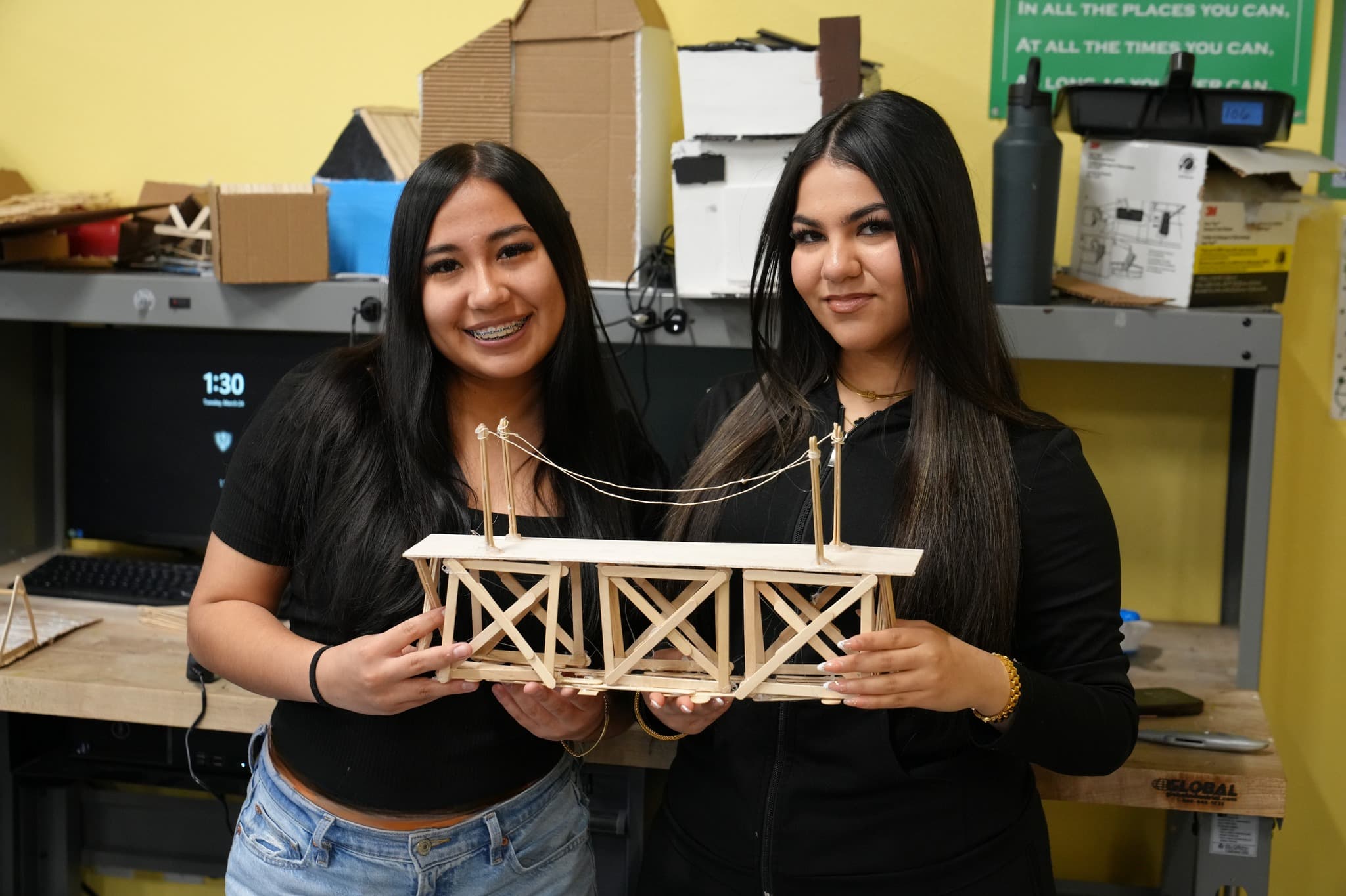 Highland Prep West students working together on an engineering bridge project