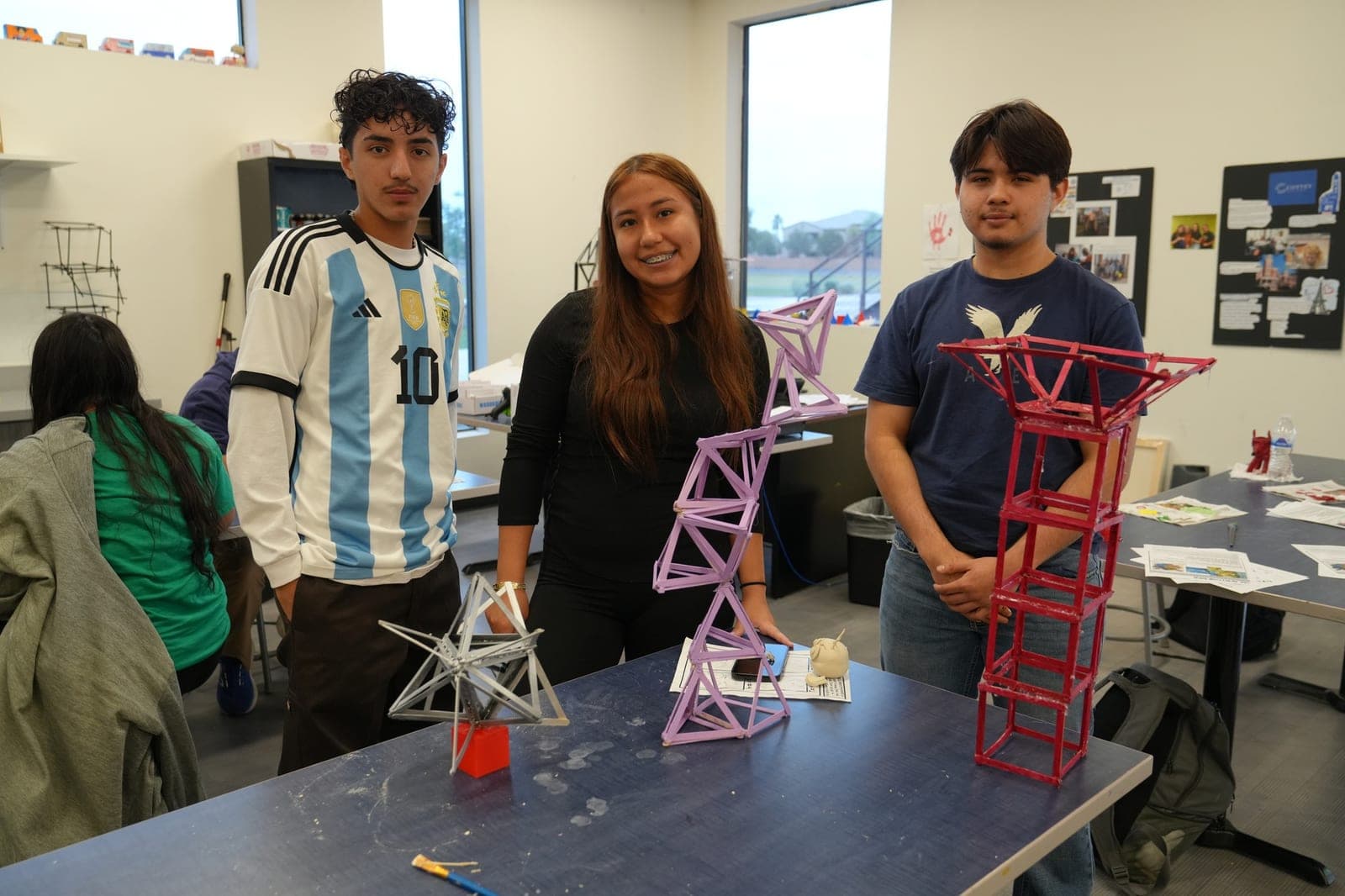 Highland Prep West students with a tall structure they engineered and built