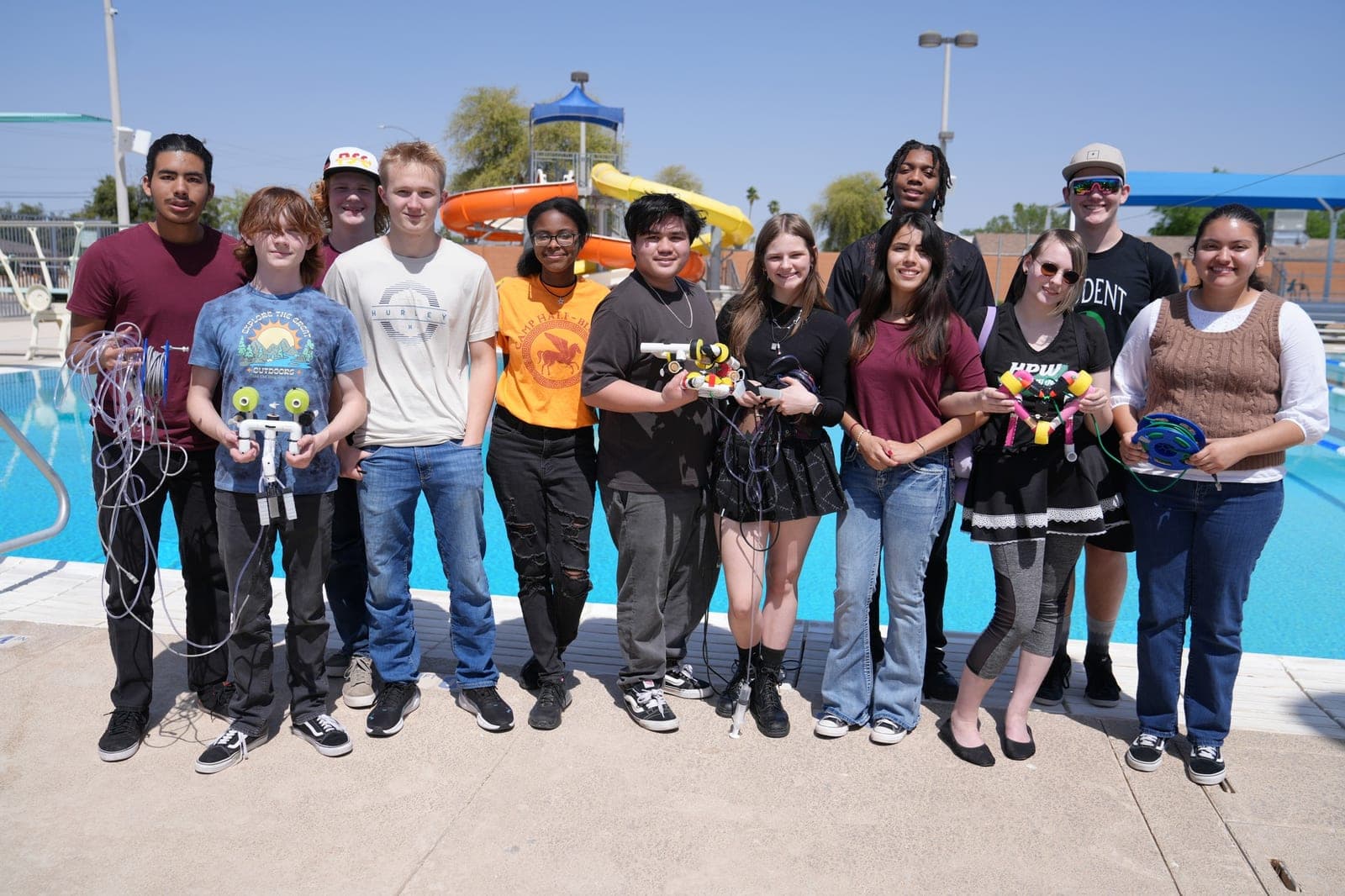 Highland Prep West's SeaPerch team celebrating a win poolside